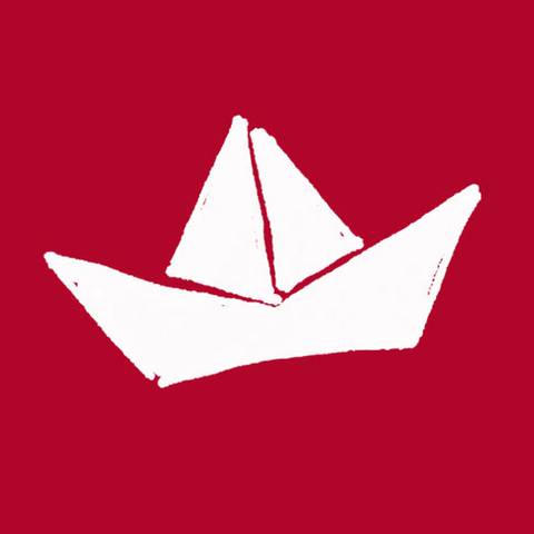Paper sailing boat on a red background